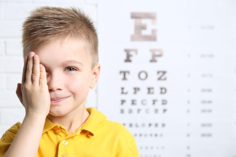 Young boy taking an eye test