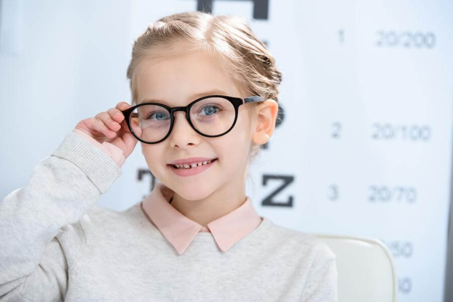 A young girl wearing glasses