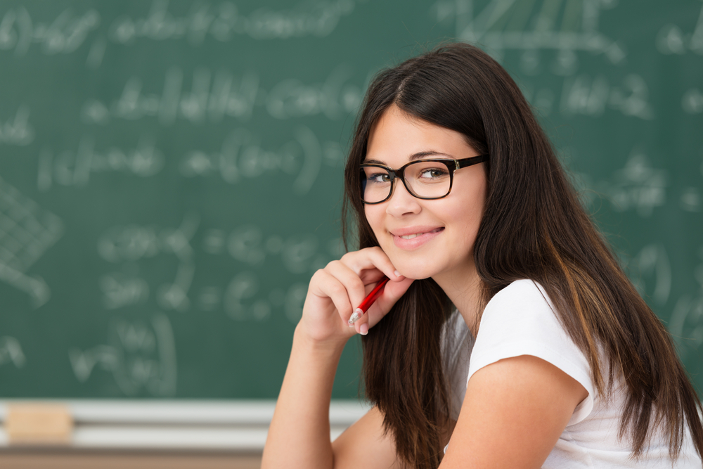 A girl wearing glasses in class room