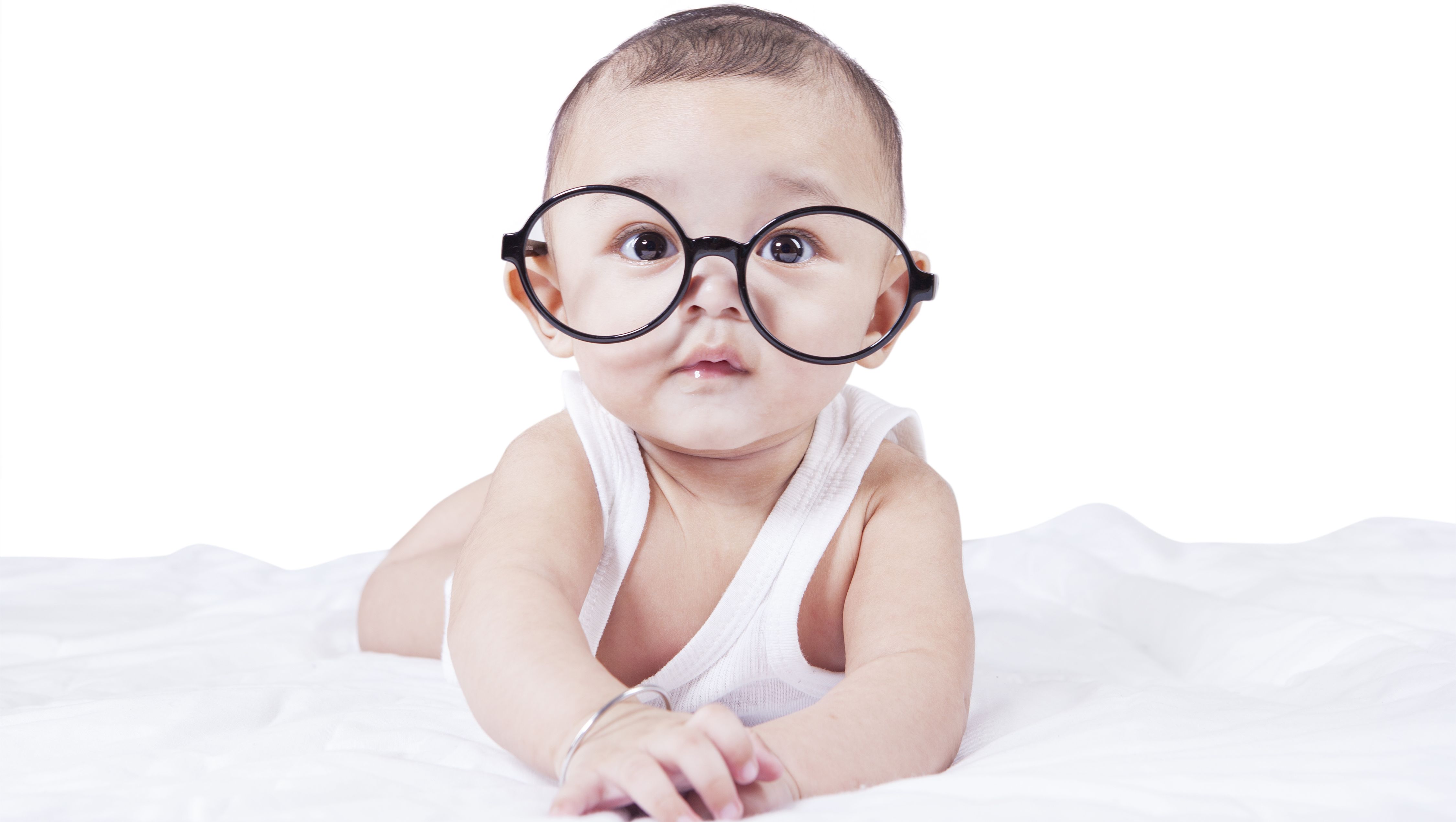 pediatric eye exams for infants: a baby wearing comically large glases