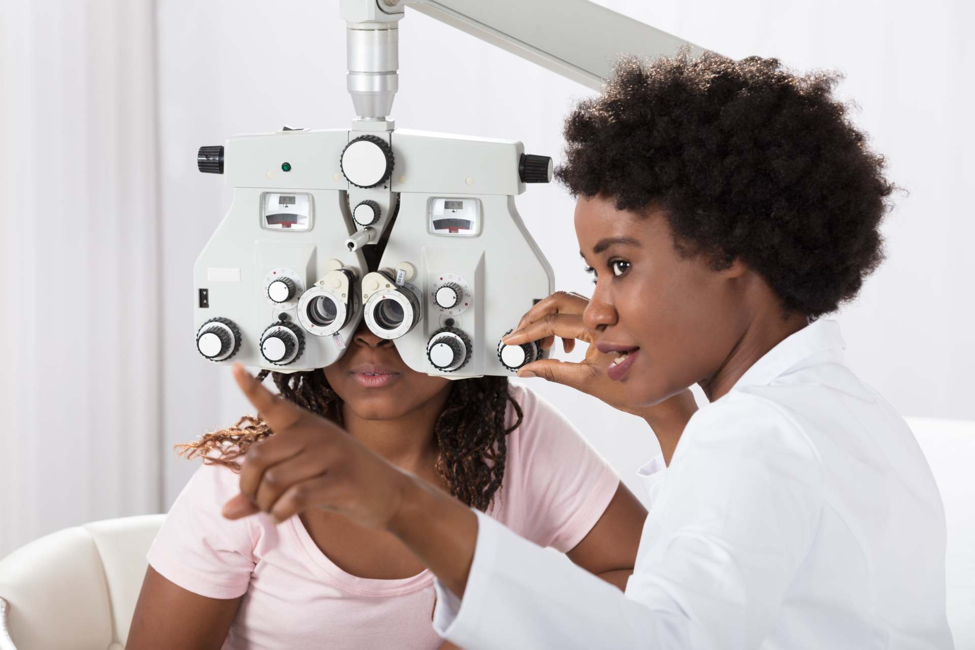 an optometrist performing the eye exam