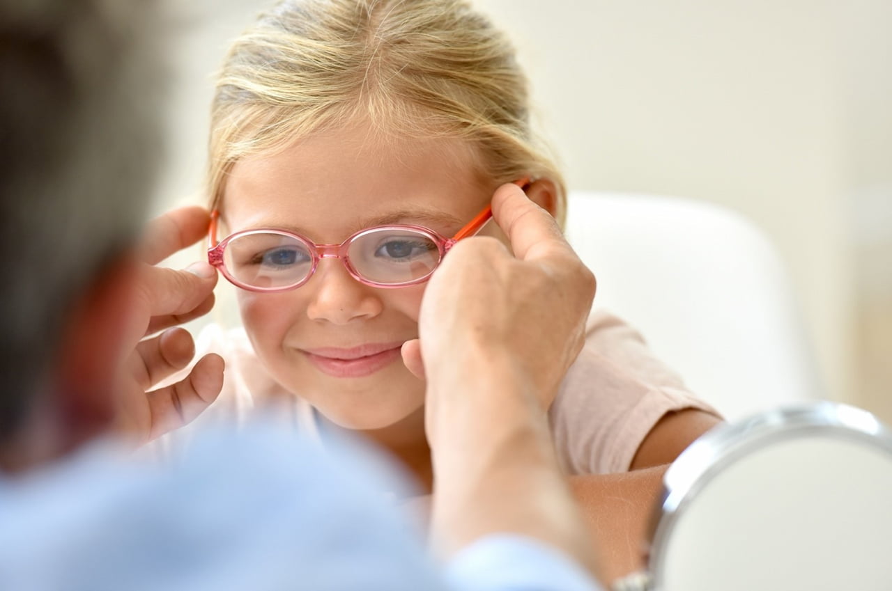 girl wearing eyeglasses to correct accommodative esotropia