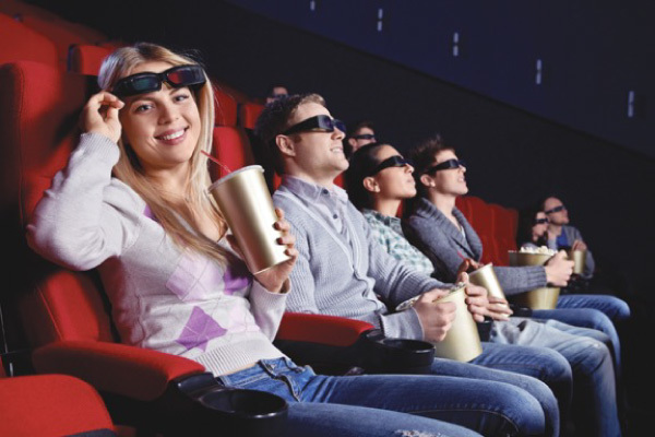 A group of people enjoying a movie with 3-D glasses in Edmonton
